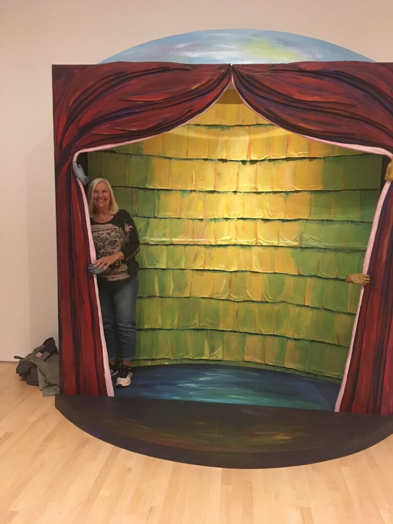 Woman peeking around curtain at the National Gallery of Canada