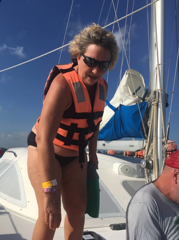 Woman on boat, lifejacket