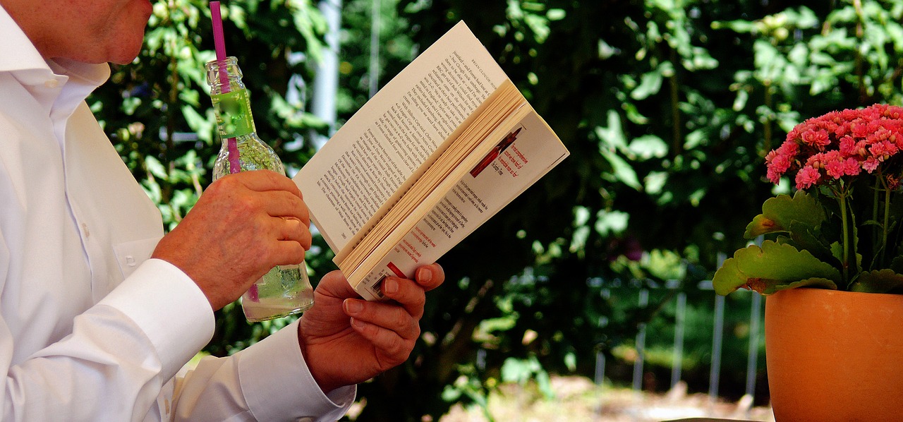 man reading book, stuck at home