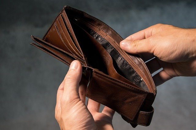 man holding empty wallet